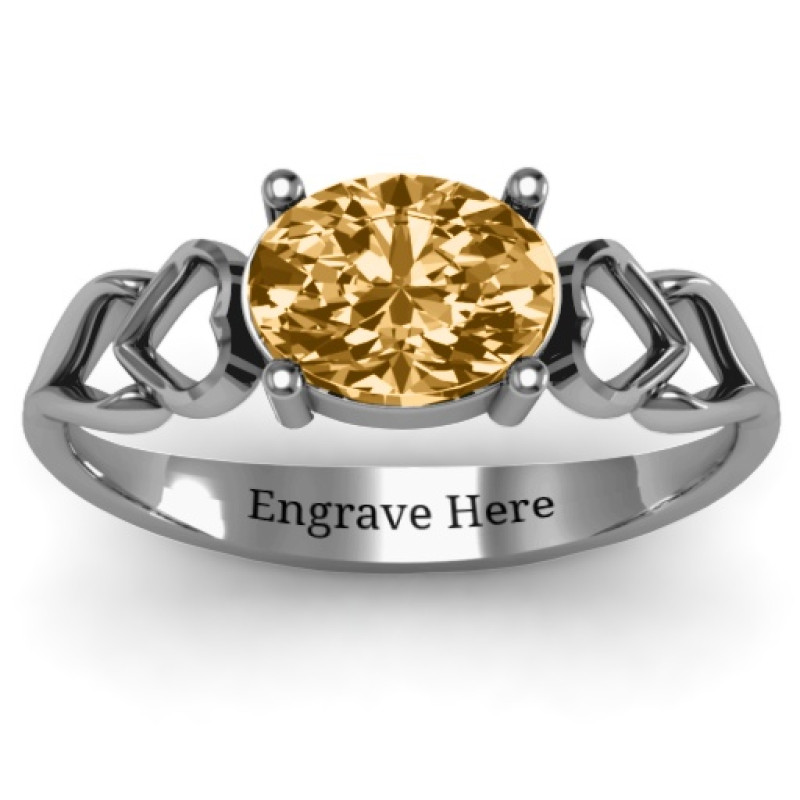Oval Solitaire Ring with Surrounding Hearts Oval solitaire ring with surrounding hearts