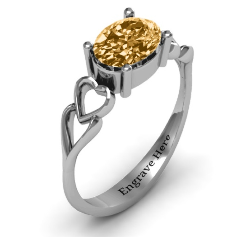 Oval Solitaire Ring with Surrounding Hearts Oval solitaire ring with surrounding hearts