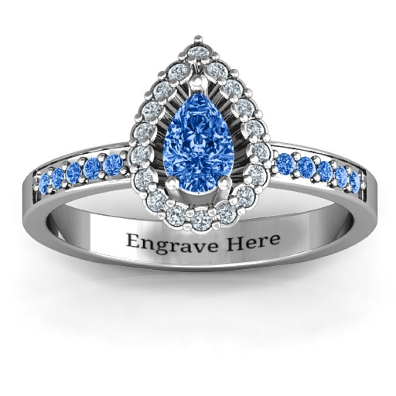 Pear shaped halo ring with a centre stone and prong-set shoulder accents