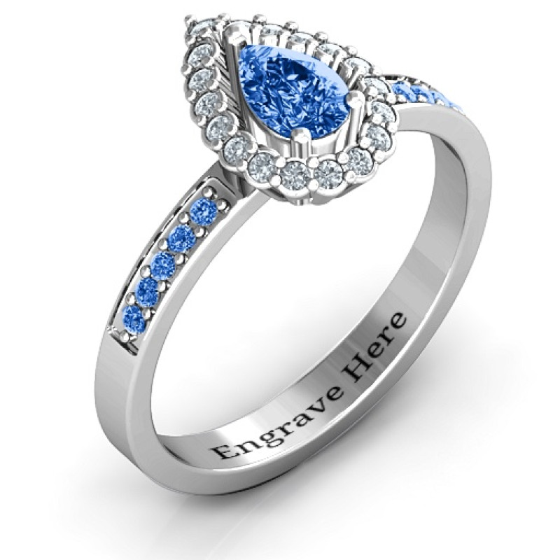 Pear shaped halo ring with a centre stone and prong-set shoulder accents