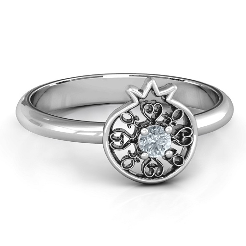 Pomegranate with filigree ring featuring a round centre stone