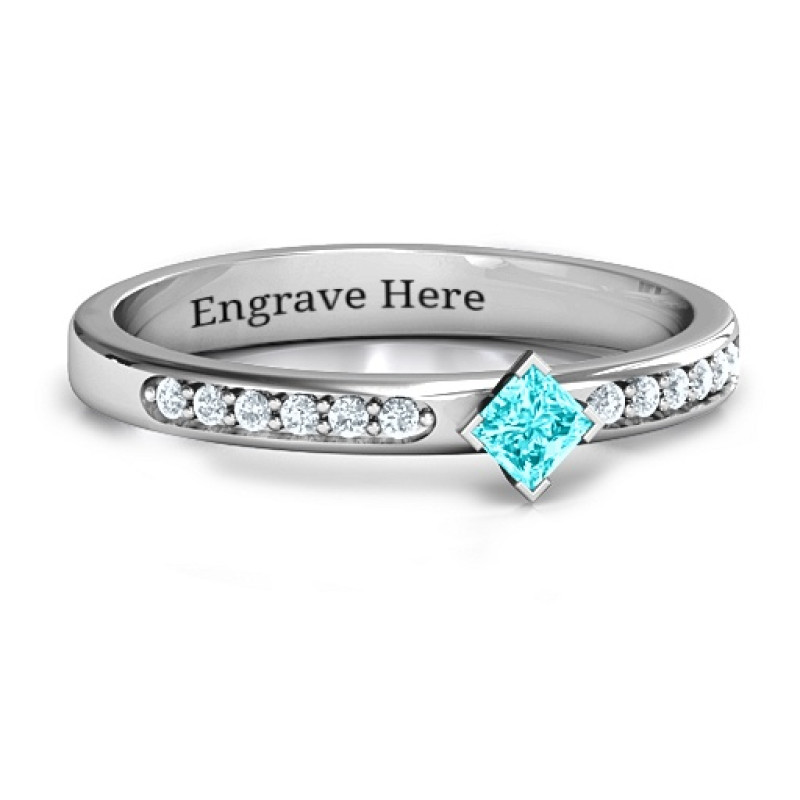 Princess centre stone ring with twin rows of accent stones