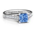Princess Cut Ring with Channel Set Accents Princess-cut zirconia ring with channel-set accent stones