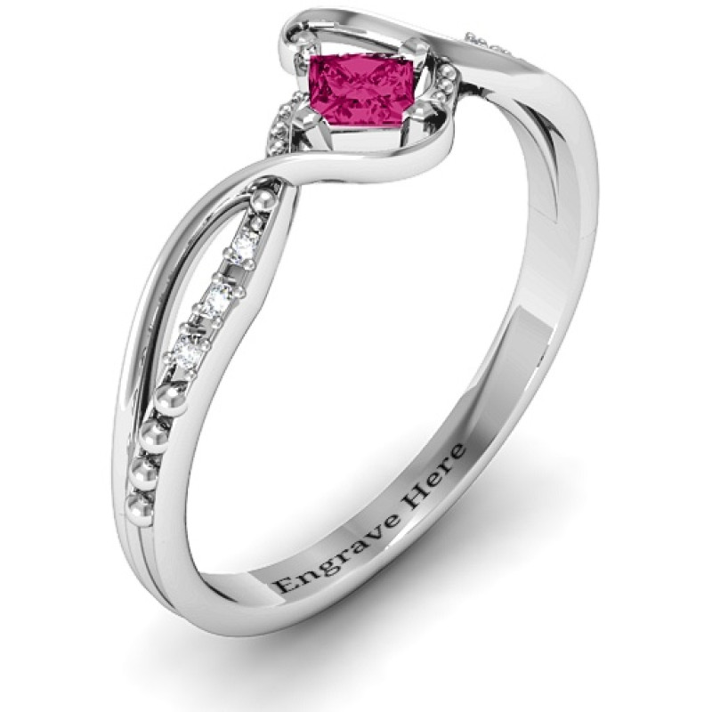 Princess-cut gemstone ring with six round accent stones