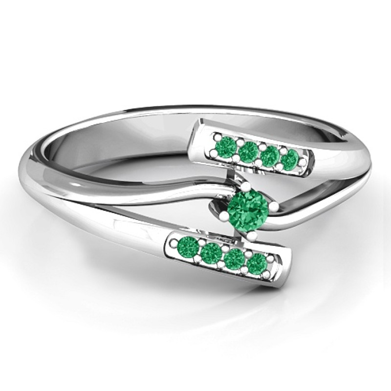 Double bypass ring with a round centre stone and channel-set accent stones