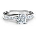 Elegant Duchess ring with round centre stone and channel-set shoulder accents