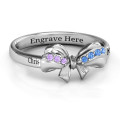 Fancy stone set bow ring with prong-set stone accents