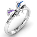 Fancy stone set bow ring detail view
