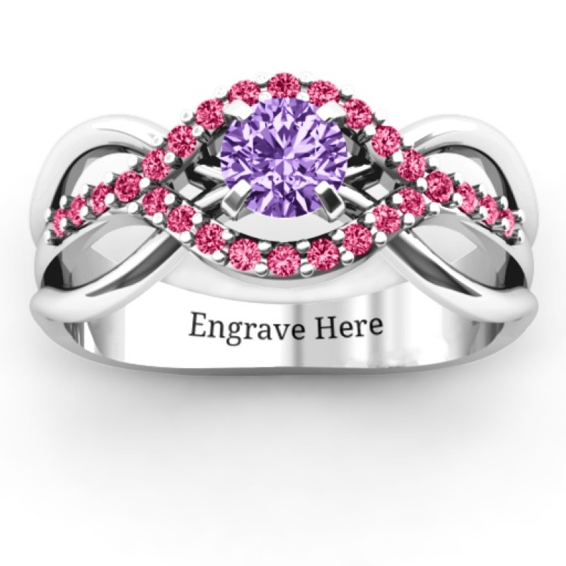 Fancy woven solitaire ring with an open crisscross band and accent stones