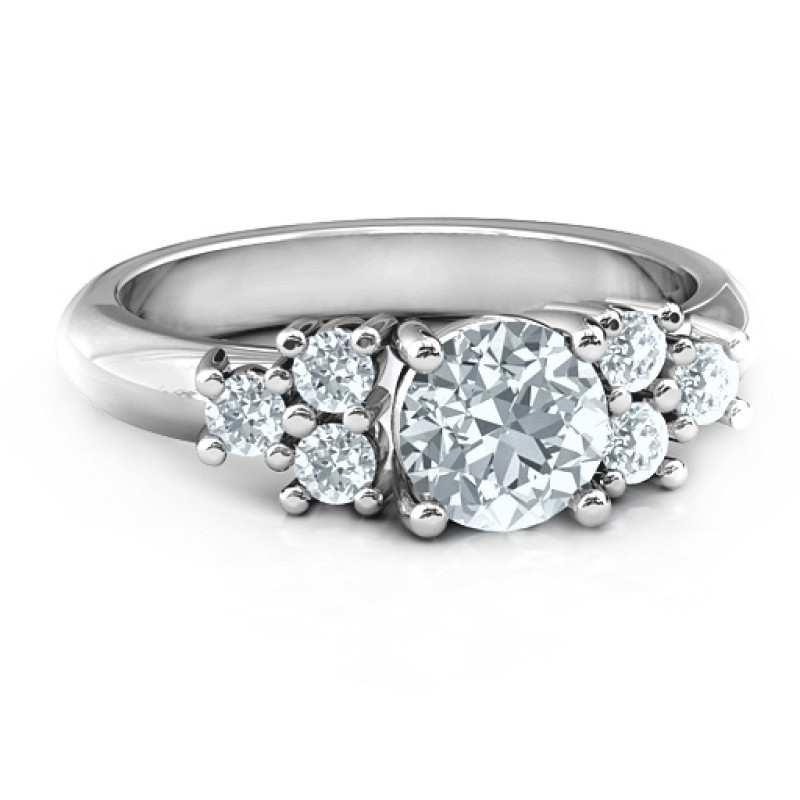 Flourish Engagement Ring Flourish engagement ring with a round centre stone and side stone clusters