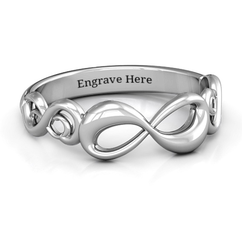 Sterling Silver Groovy Infinity Ring Groovy infinity ring with a central infinity symbol and two smaller side symbols