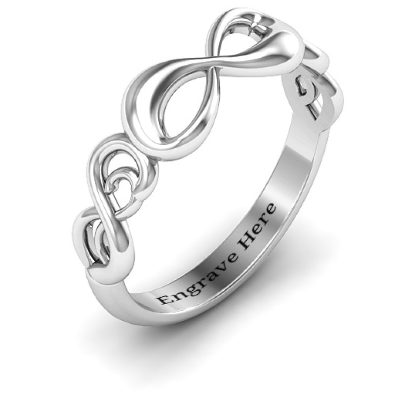 Sterling Silver Groovy Infinity Ring Groovy infinity ring with a central infinity symbol and two smaller side symbols