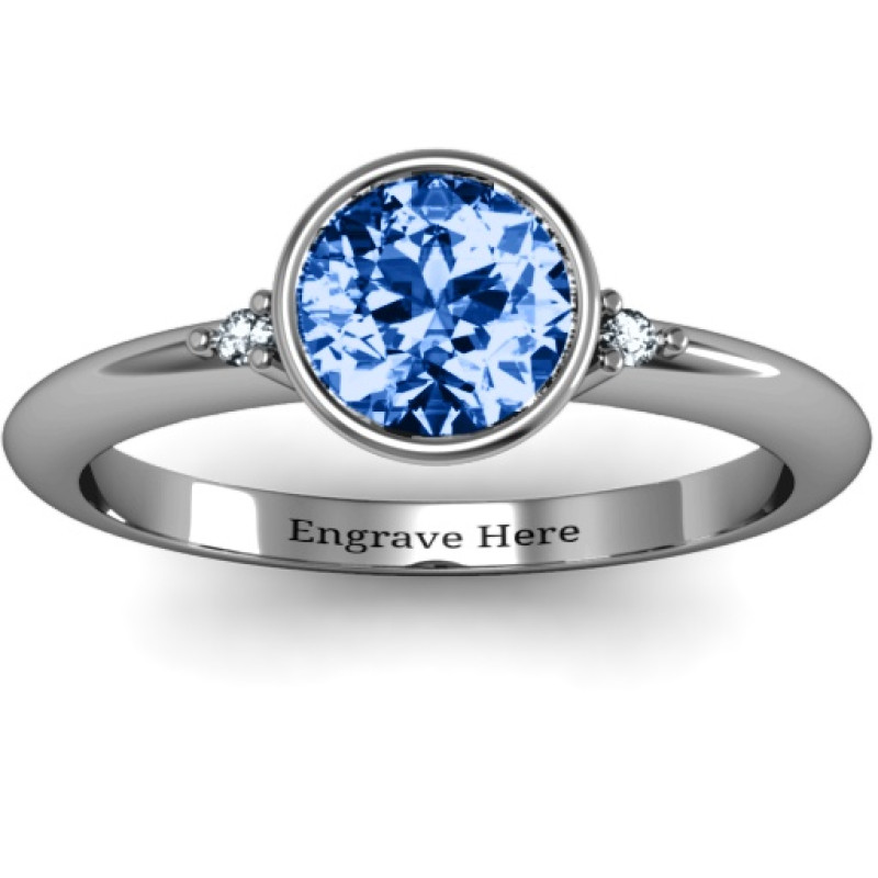 Round bezel solitaire ring with twin accent stones