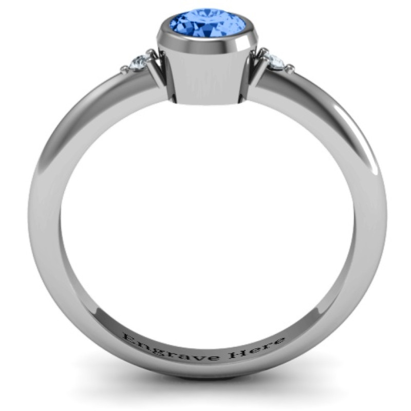 Round bezel solitaire ring with twin accent stones