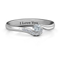 Solitaire Wave Ring with Stone Accents Solitaire wave ring with a round centre stone and accent stones