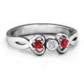 Twin Hearts with Centre Bezel Ring Twin Hearts with Centre Bezel Ring with three round stones and heart details
