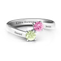 Two-stone ring with filigree settings and bypass band