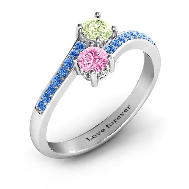 Two stone ring with sparkling accent stones and filigree settings