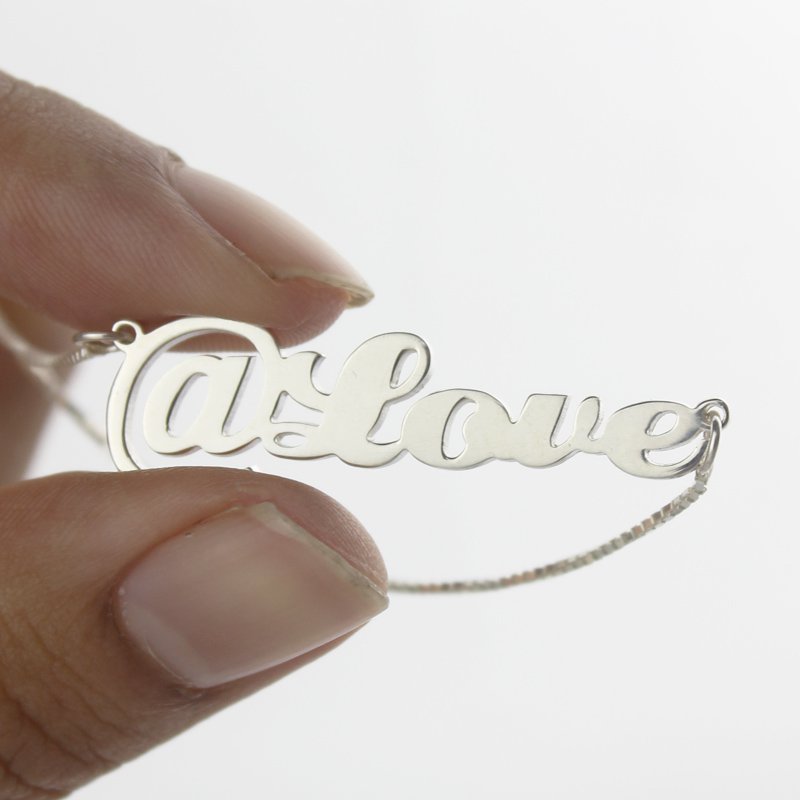 Detail view of the personalised @ symbol name necklace