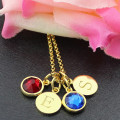 Double Disc Initial Family Pendant Double-disc family pendant with initials and birthstones