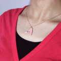 Personalised New York state-shaped heart name necklace detail view