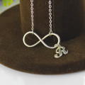Infinity Necklace Initial Charm Detail Close view of the infinity necklace and initial charm