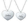 Matching engraved heart pendant necklaces for mother and daughter
