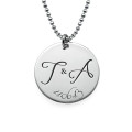 Engraved initial necklace with two initials and a special date on a round disc pendant