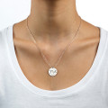 Engraved initial necklace with two initials and a special date on a round disc pendant