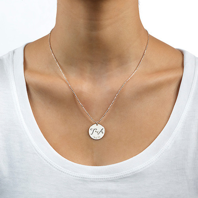 Engraved initial necklace with two initials and a special date on a round disc pendant