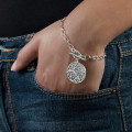 Filigree Tree of Life Bracelet Detail Filigree Tree of Life bracelet with tree pendant and link chain