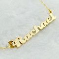 Gold Love Pendant Close-up of a gold personalised name pendant