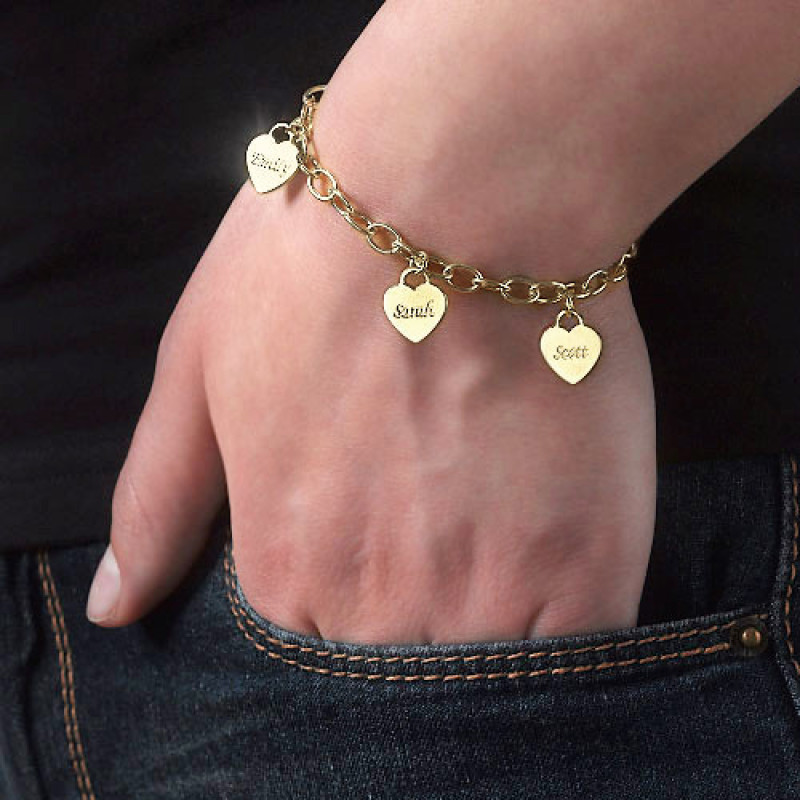 Gold plated heart charm bracelet with personalised pendants on a link chain