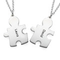 Personalised silver puzzle necklace with two engraved jigsaw piece pendants
