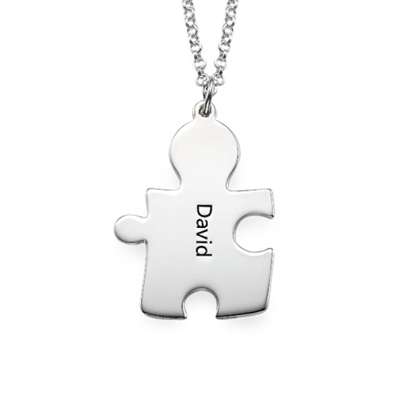 Detail view of personalised silver puzzle necklace pendants