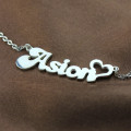 Silver letter pendant necklace detail