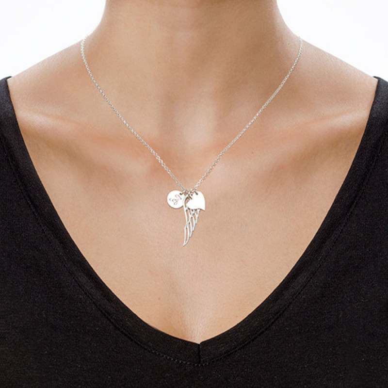 Sterling silver angel wing necklace with heart charm and initial pendant