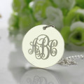 White gold round pendant with engraved monogram