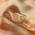 Engraved square monogram ring detail view