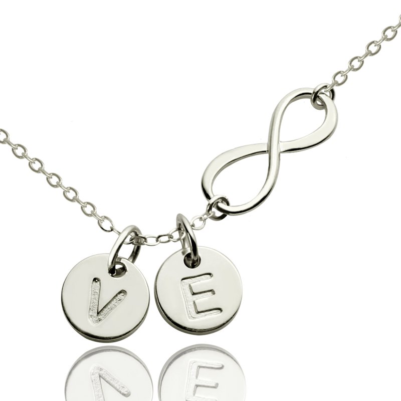 Custom infinity initial necklace with an infinity charm and initial disc