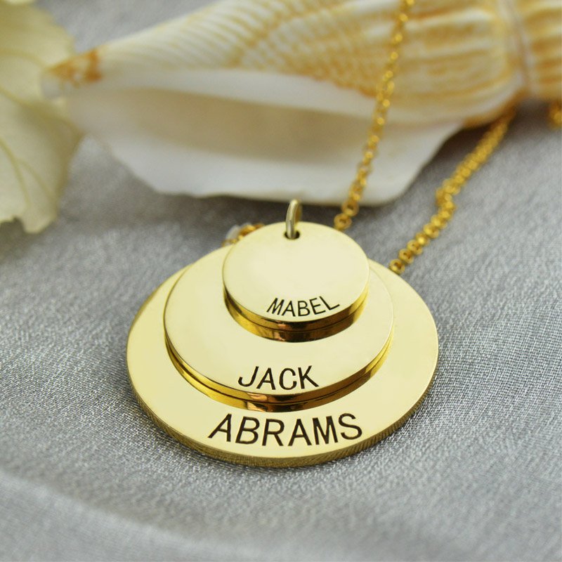 Personalised three-layer disc necklace detail Personalised three-layer disc necklace engraved with names