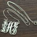 Sterling silver five-initial monogram pendant with flowing script