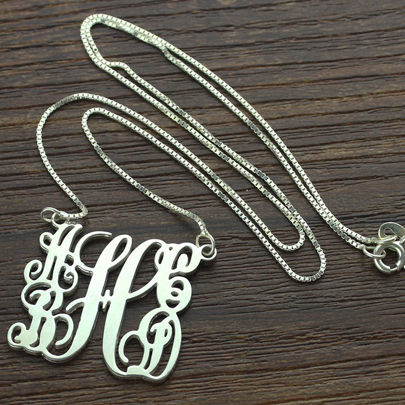 Sterling silver five-initial monogram pendant with flowing script