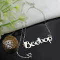 Solid white gold custom name necklace with Beetle font lettering