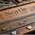 Neatie Jewelry Workbench With Infinity Pendants And Tools