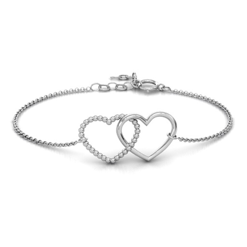 Personalised Opposites Attract bracelet with two interlocked hearts