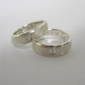 Slim Diamond Set Band Slim diamond set silver band with a round white diamond