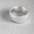 Domed sand cast wedding ring detail