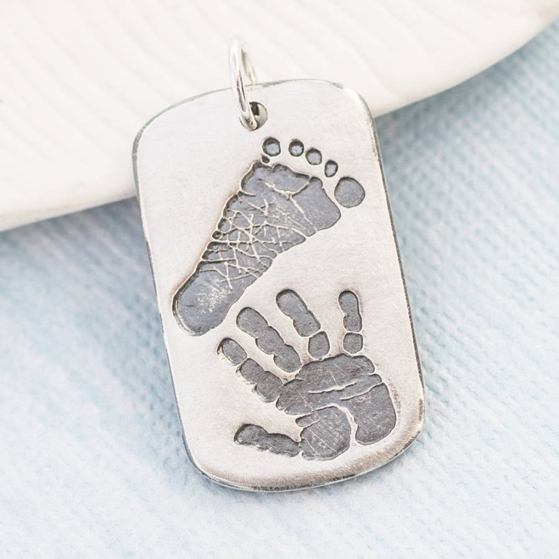 Personalised dog tag necklace with handprint and footprint details