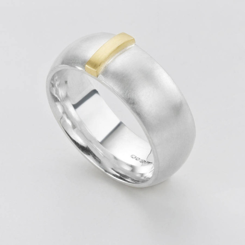 Linear Ring with a wide silver band and raised gold detail
